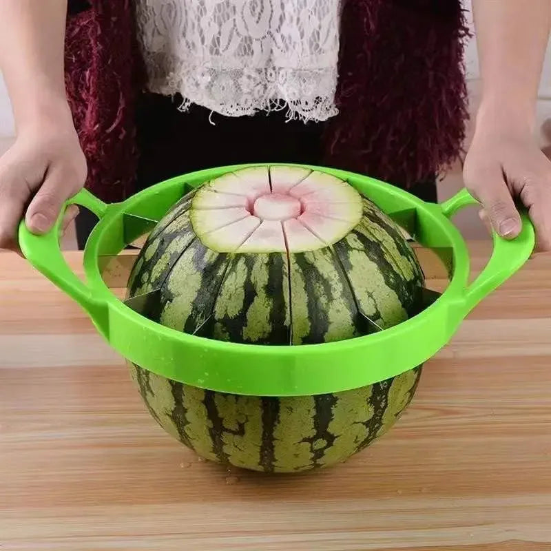 Stainless steel circular watermelon slicer with 12 blades and green handles.